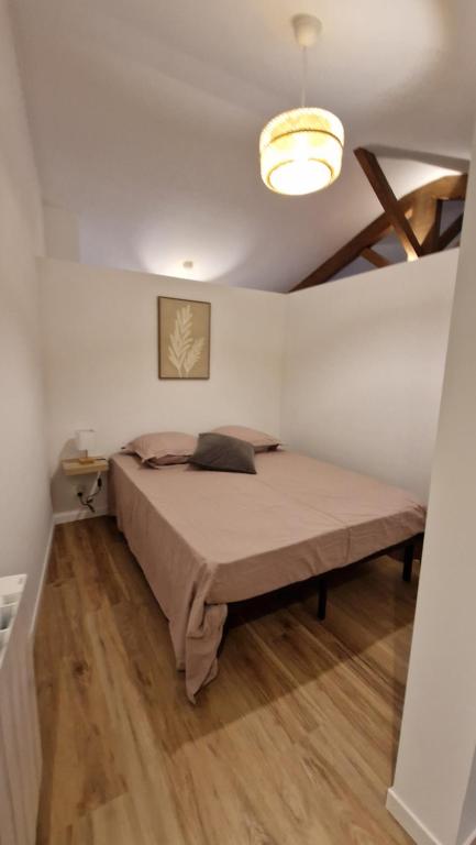 Postel nebo postele na pokoji v ubytování Le Bourg