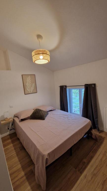 Postel nebo postele na pokoji v ubytování Le Bourg