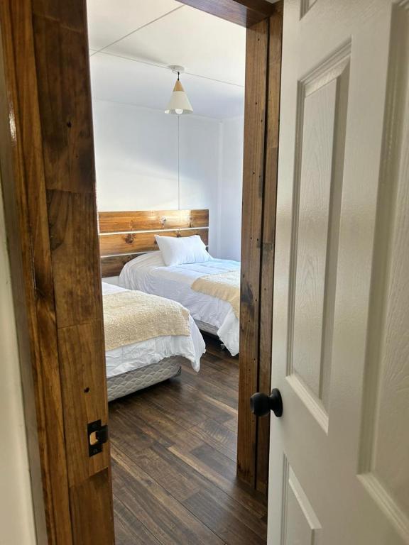 Postel nebo postele na pokoji v ubytování Terra Hostal