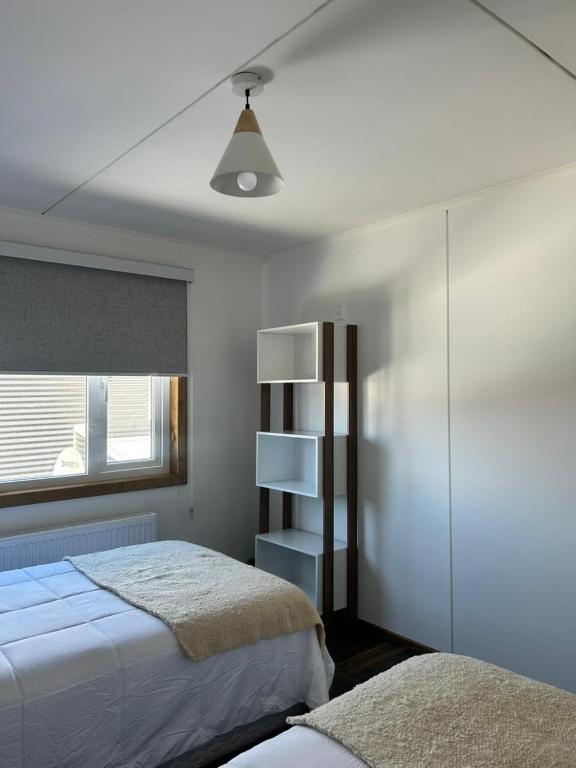 Postel nebo postele na pokoji v ubytování Terra Hostal