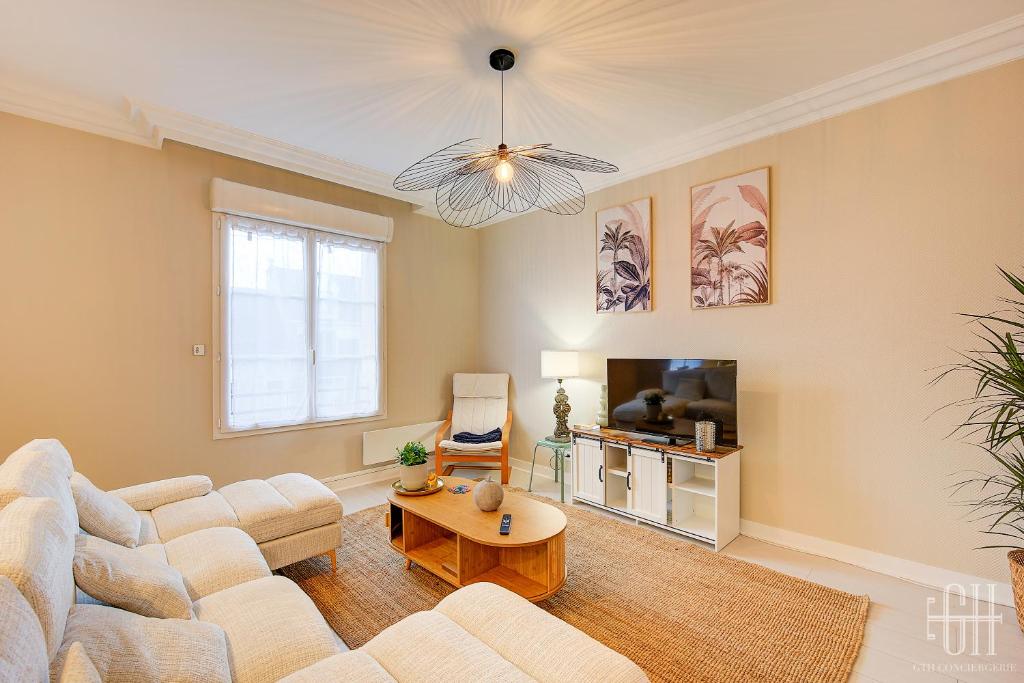 Μια τηλεόραση ή/και κέντρο ψυχαγωγίας στο Appartement avec chambre proche Gare et wifi fibre