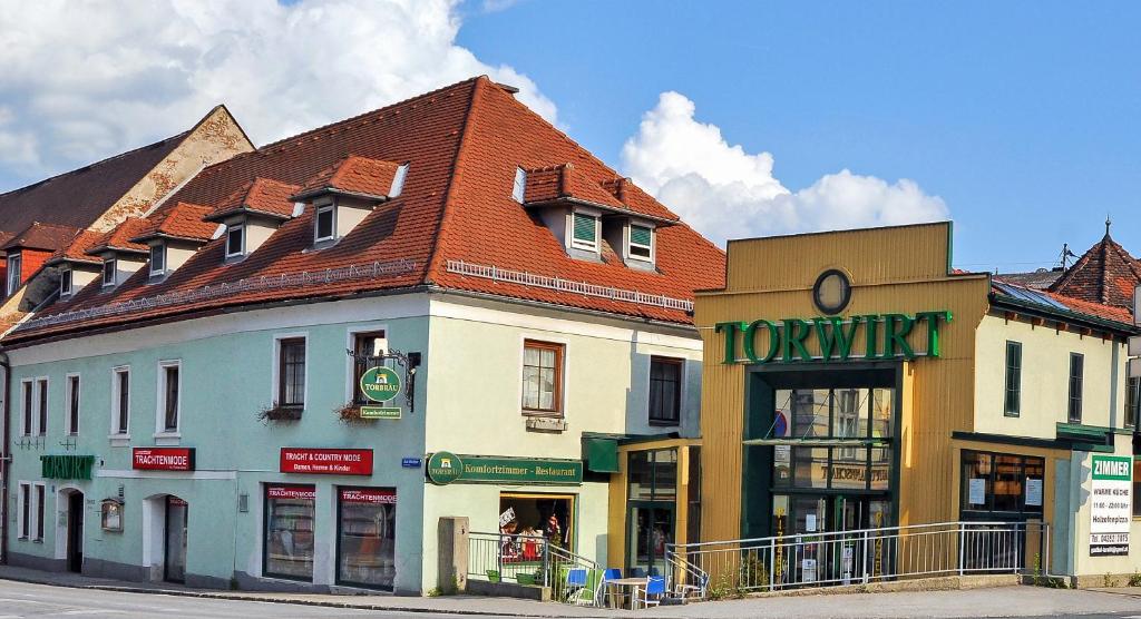 a group of buildings on the side of a street at Hotel Torwirt in Wolfsberg