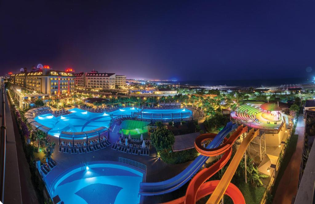 an aerial view of a water park at night at Aydinbey King's Palace in Side