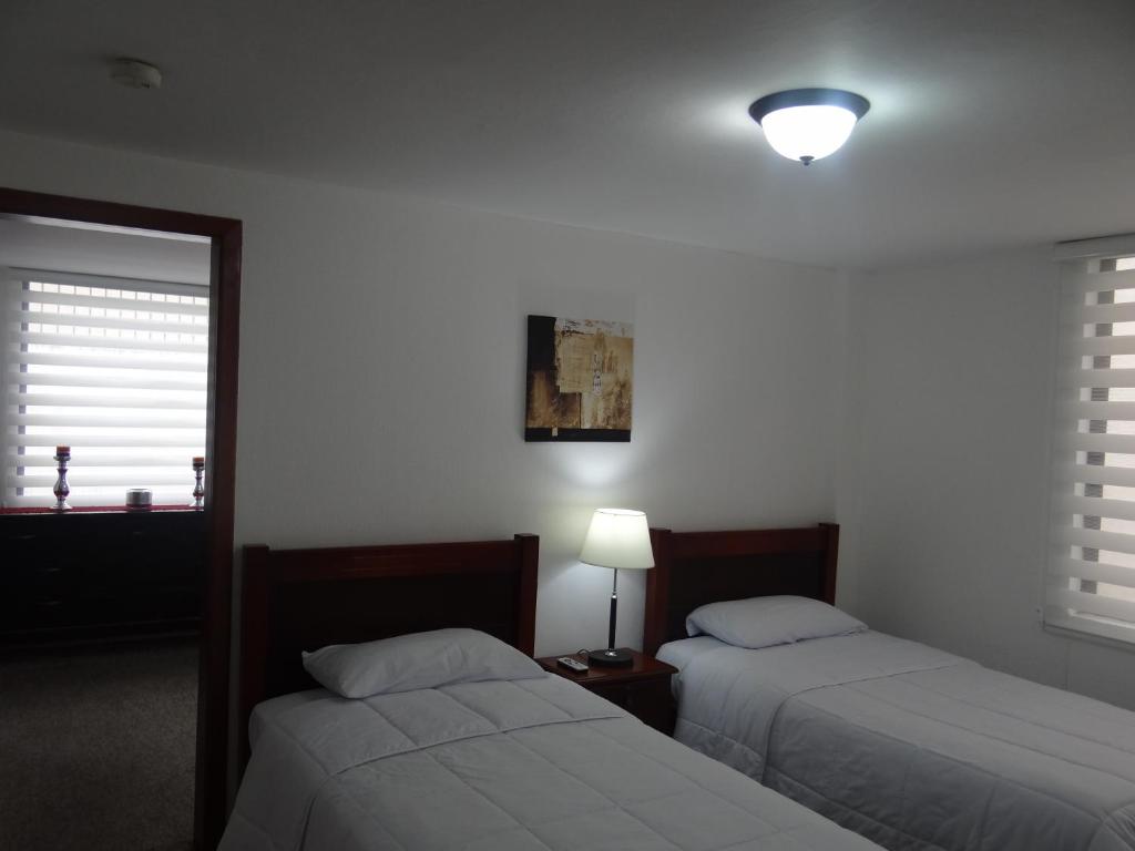 Postel nebo postele na pokoji v ubytování Altura Rooms & Suites