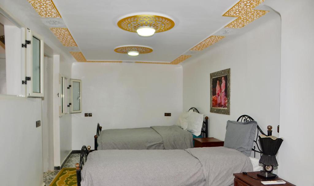 Postel nebo postele na pokoji v ubytování Araf House