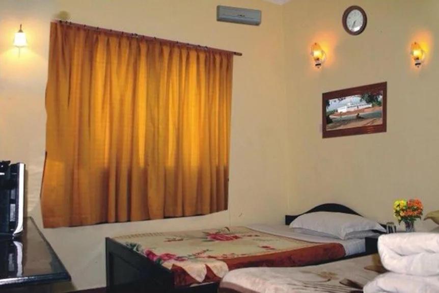 Postel nebo postele na pokoji v ubytování Siddhartha Guest House