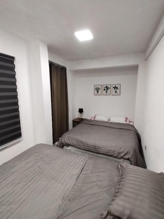 Postel nebo postele na pokoji v ubytování Ap 90 O´ H Apart
