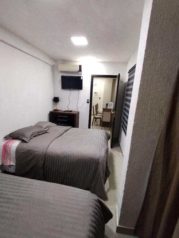 Postel nebo postele na pokoji v ubytování Ap 90 O´ H Apart