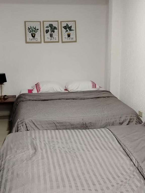 Postel nebo postele na pokoji v ubytování Ap 90 O´ H Apart