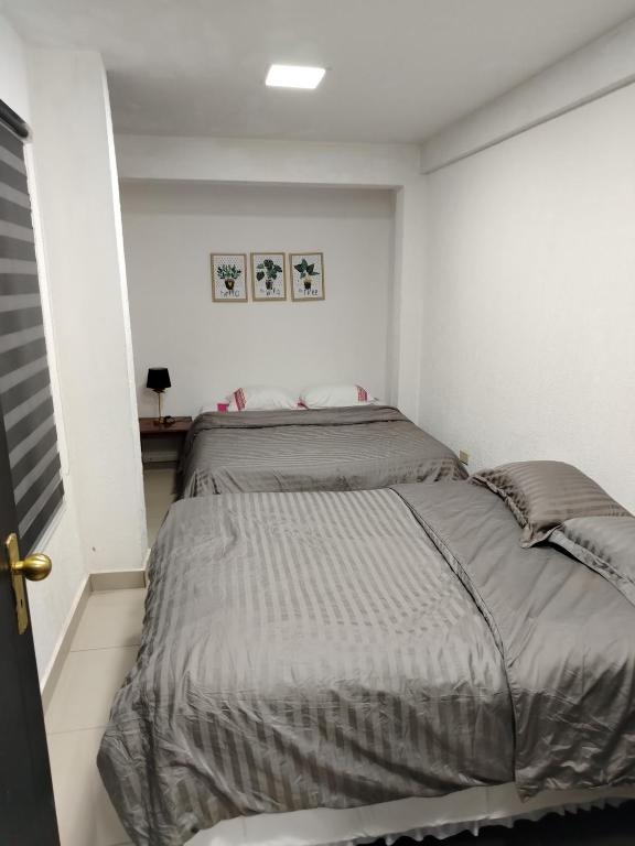 Postel nebo postele na pokoji v ubytování Ap 90 O´ H Apart