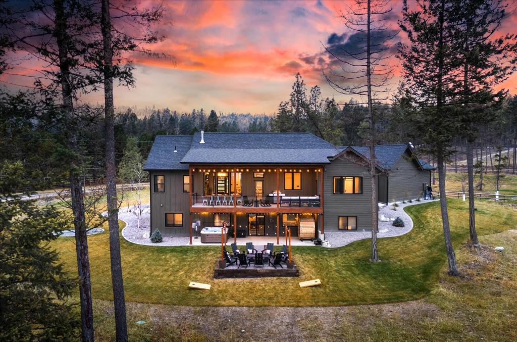 an aerial view of a house in the woods at Luxe Lakeside New Build by Flathead Lake Speakeasy in Somers