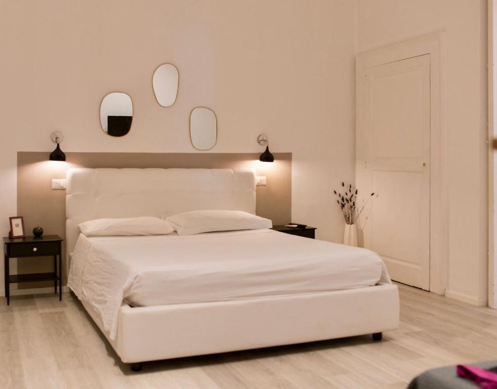 A bed or beds in a room at b&b boutique suite bari