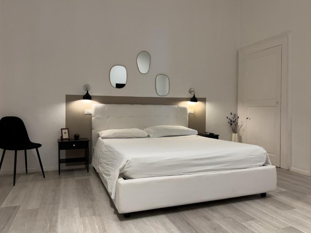 A bed or beds in a room at b&b boutique suite bari