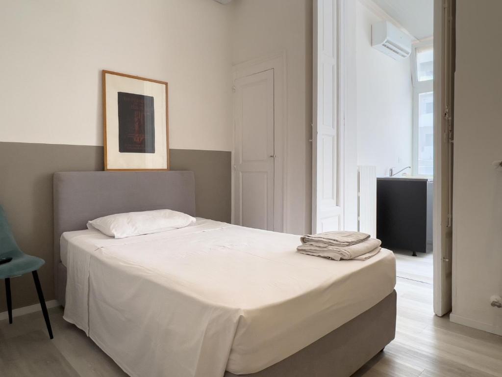 A bed or beds in a room at b&b boutique suite bari