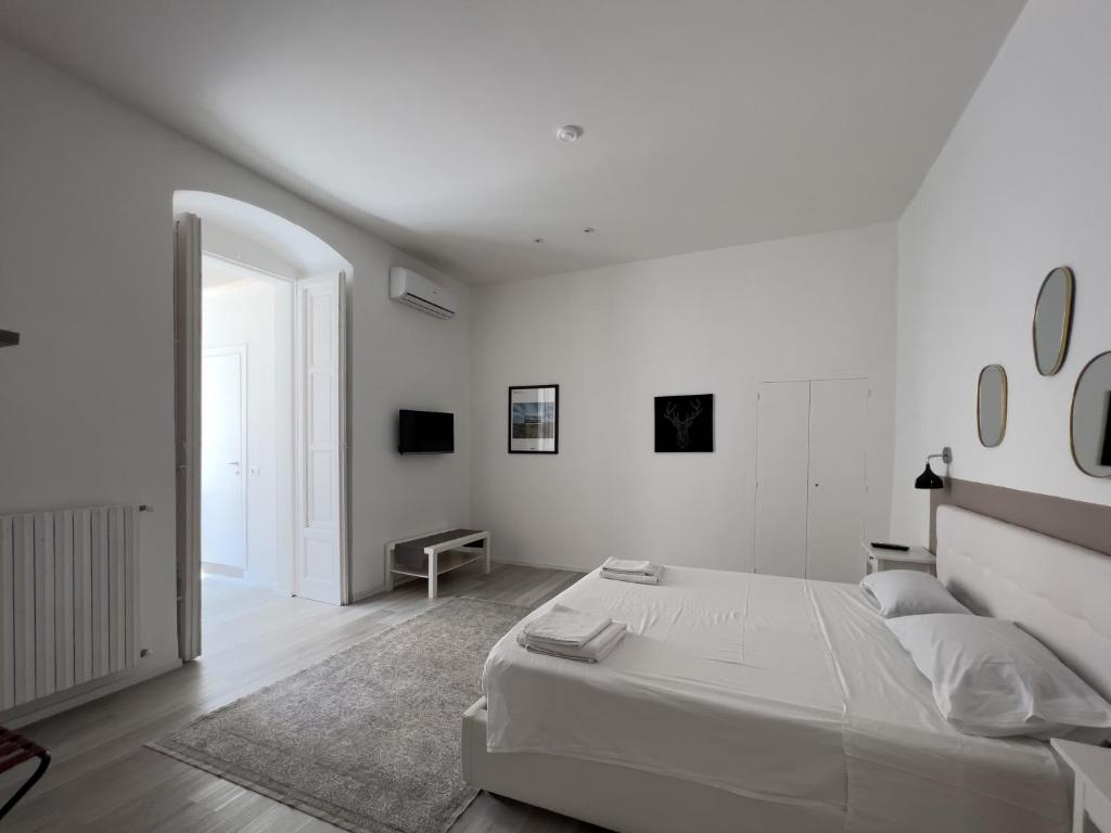 A bed or beds in a room at b&b boutique suite bari