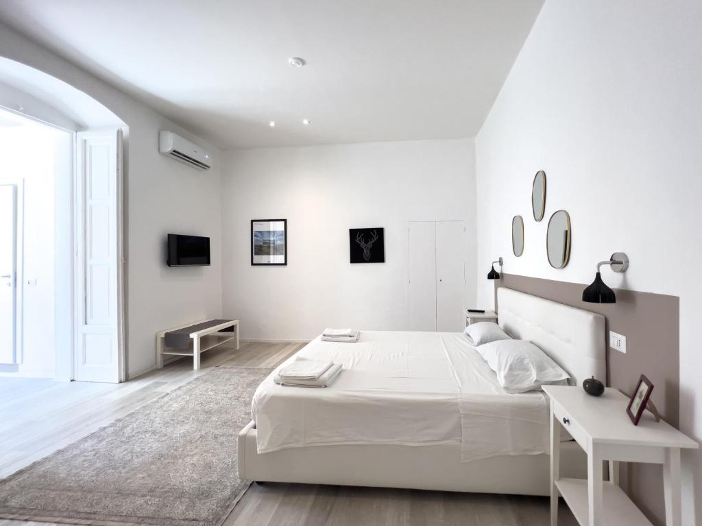 A bed or beds in a room at b&b boutique suite bari