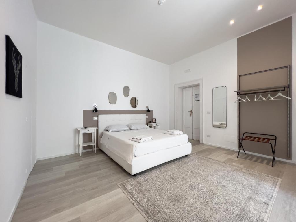 A bed or beds in a room at b&b boutique suite bari
