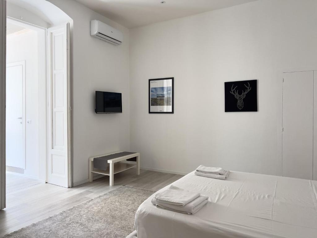 A bed or beds in a room at b&b boutique suite bari