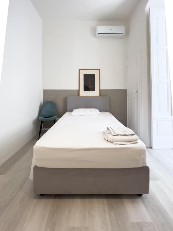 A bed or beds in a room at b&b boutique suite bari