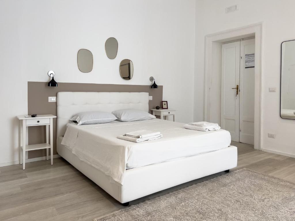 A bed or beds in a room at b&b boutique suite bari