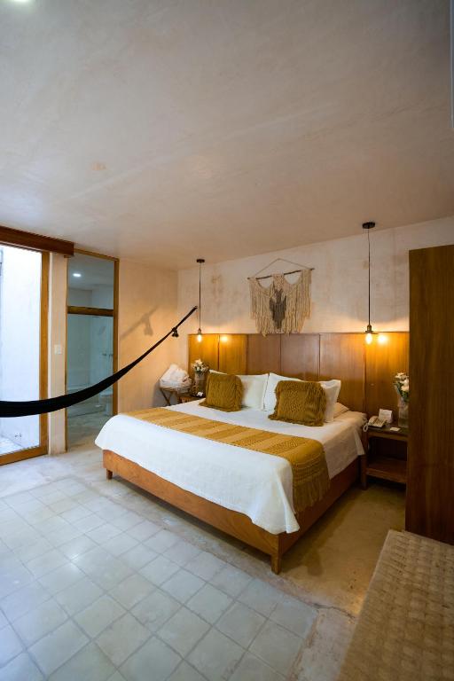Uma cama ou camas num quarto em Colonte Hotel Origen