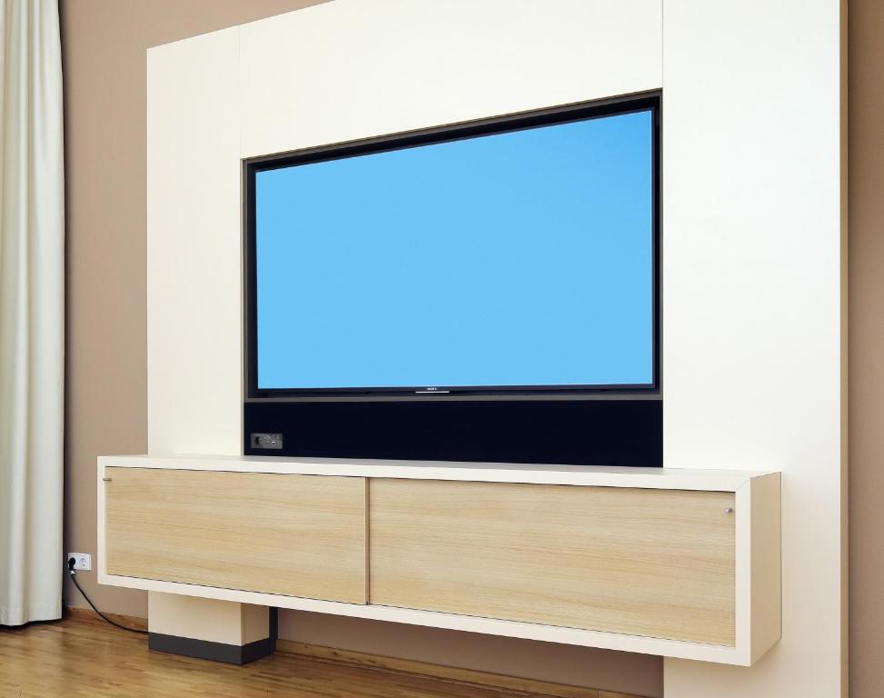 TV a/nebo společenská místnost v ubytování Hotel Flandrischer Hof