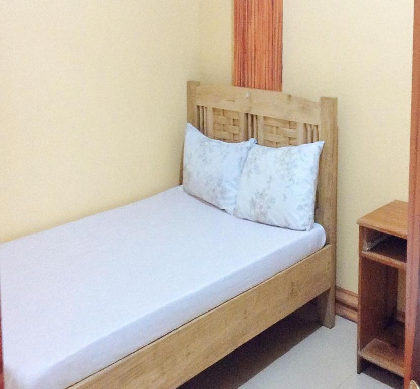 Postel nebo postele na pokoji v ubytování RedDoorz Hostel at Baguio Tourist Cabin