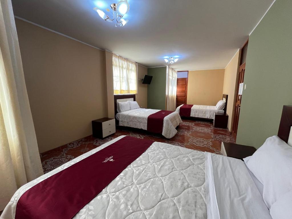 Postel nebo postele na pokoji v ubytování HOTEL AREQUIPA