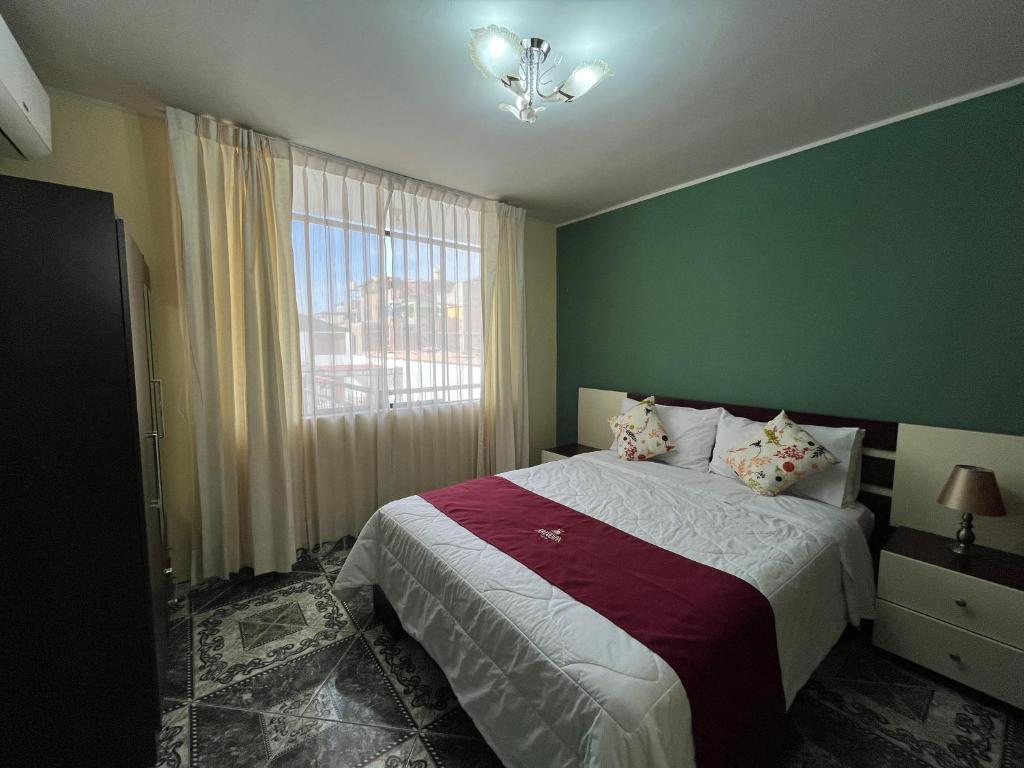 Postel nebo postele na pokoji v ubytování HOTEL AREQUIPA