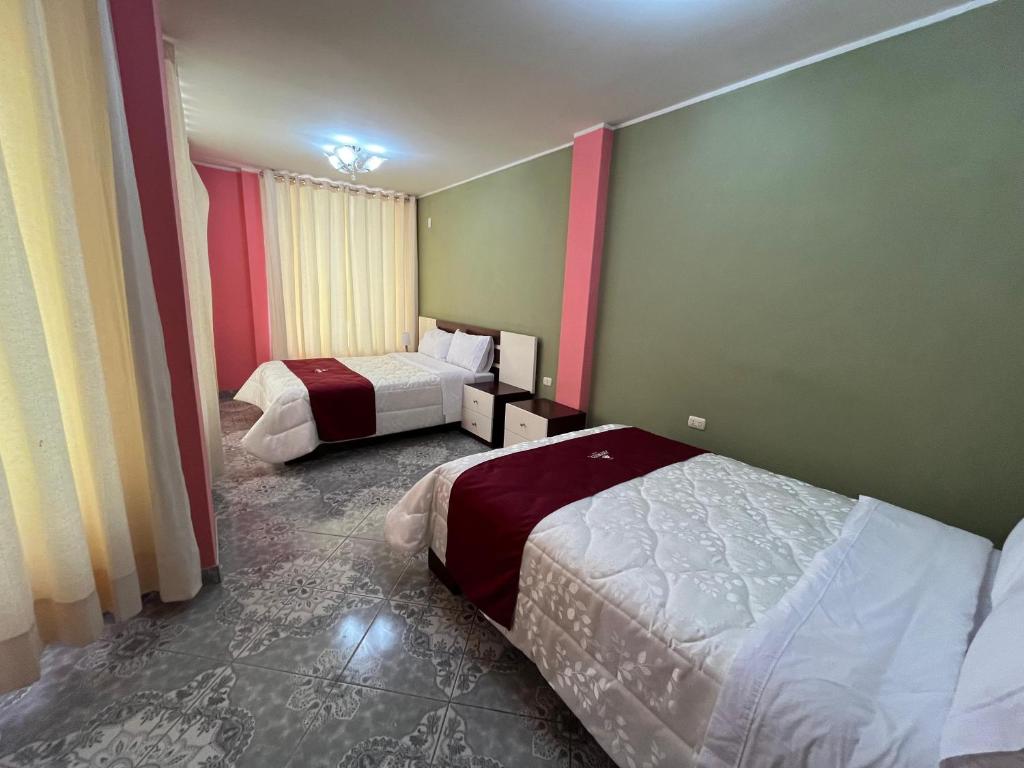 Postel nebo postele na pokoji v ubytování HOTEL AREQUIPA