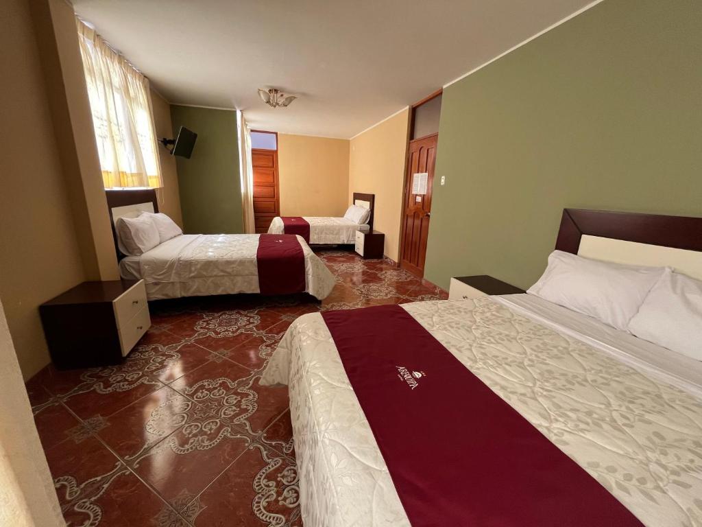 Postel nebo postele na pokoji v ubytování HOTEL AREQUIPA