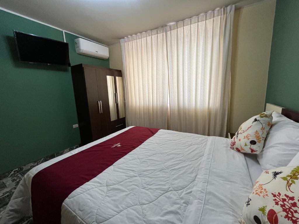 Postel nebo postele na pokoji v ubytování HOTEL AREQUIPA