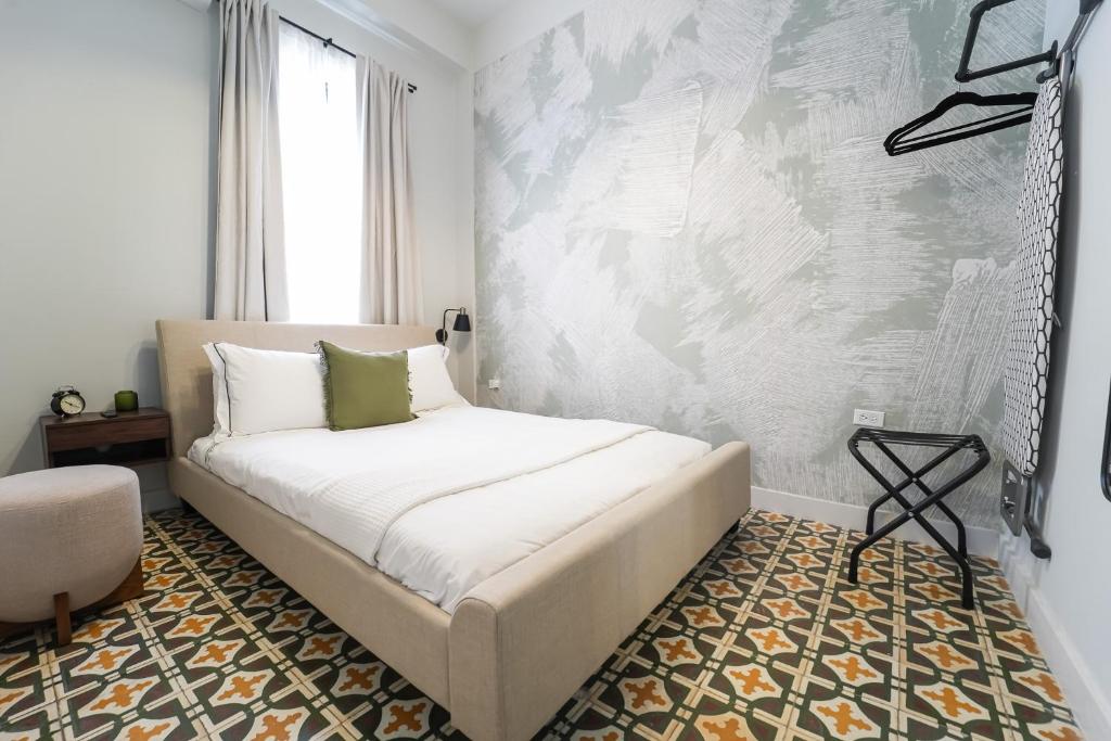 Postel nebo postele na pokoji v ubytování Patio Elba Boutique Hotel