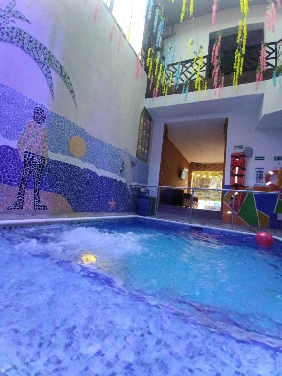 Bazén v ubytování PH BOUTIQUE HOTEL Girardot nebo v jeho okolí