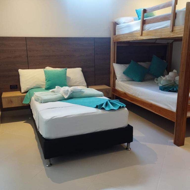 Postel nebo postele na pokoji v ubytování Hotel Luna Verde