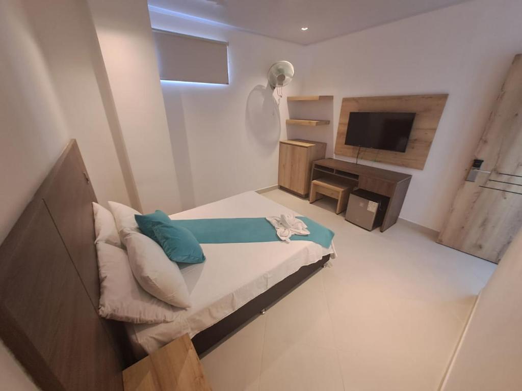 Postel nebo postele na pokoji v ubytování Hotel Luna Verde
