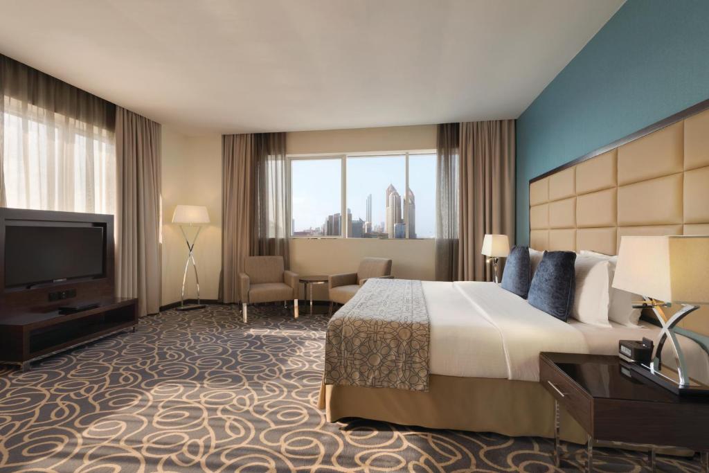 Cama o camas de una habitación en Ramada Abu Dhabi Corniche