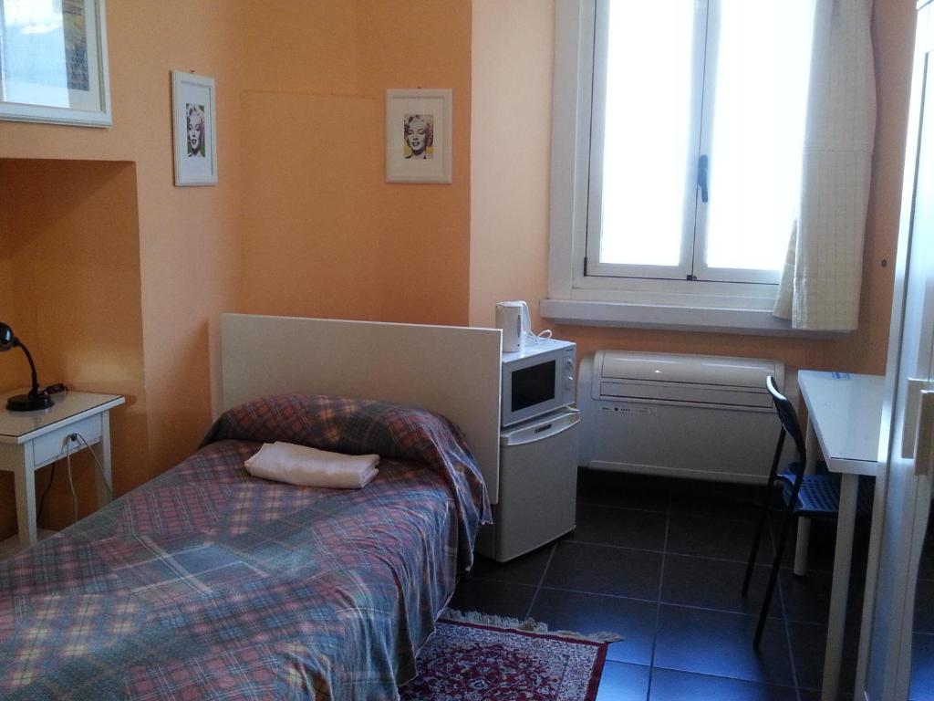 Postel nebo postele na pokoji v ubytování Affittacamere Andronaco