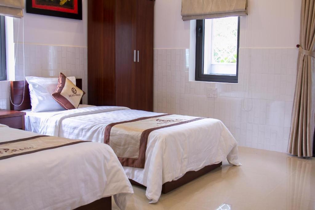 Postel nebo postele na pokoji v ubytování Bean Grass Homestay