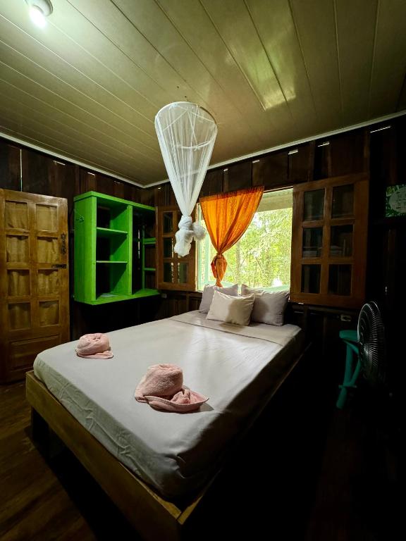 Postel nebo postele na pokoji v ubytování Madre Selva Hostel