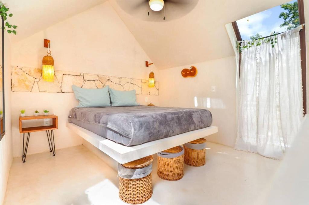 Postel nebo postele na pokoji v ubytování Loft Cabins In Cenotes Natural Park Tulum