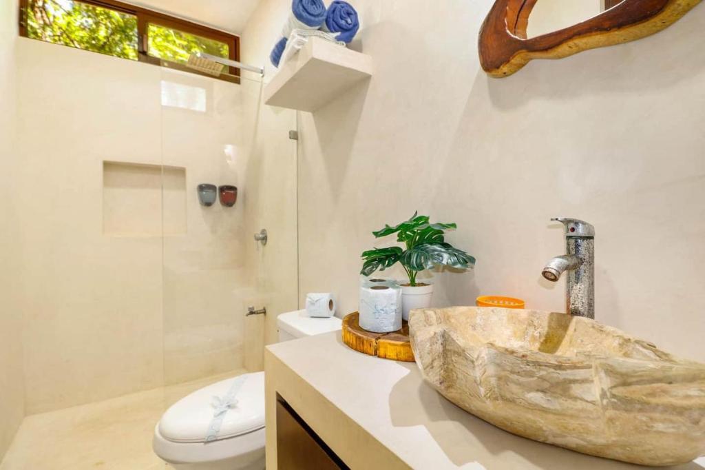 Koupelna v ubytování Loft Cabins In Cenotes Natural Park Tulum