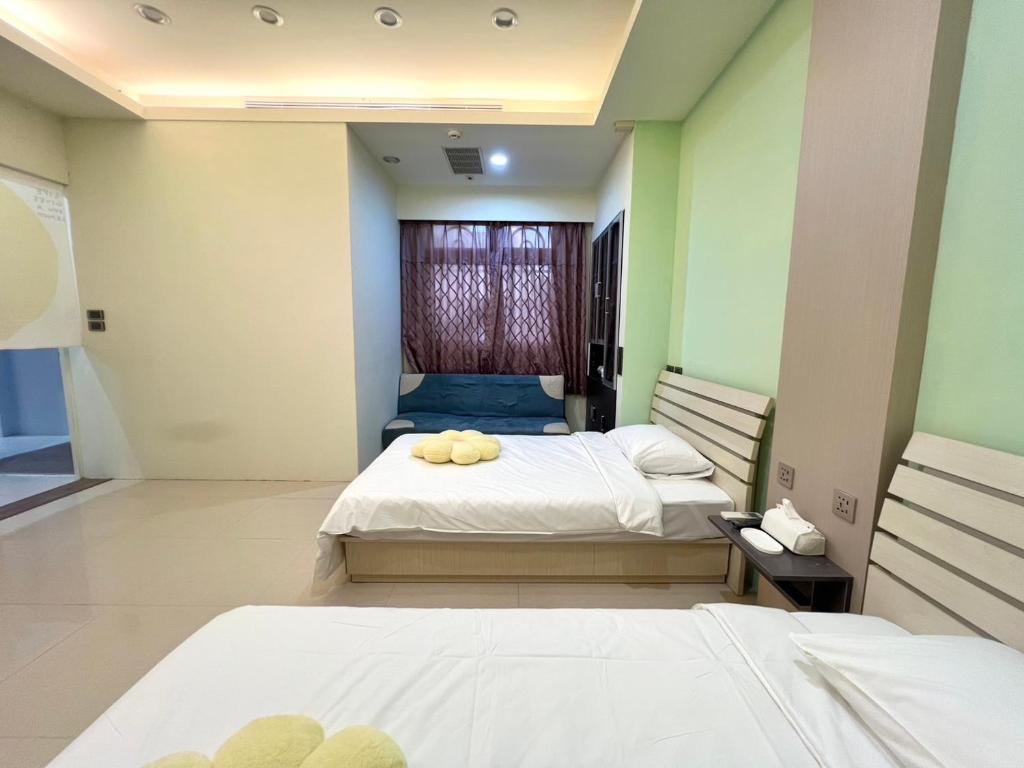 Katil atau katil-katil dalam bilik di Kinmen Harved B&B