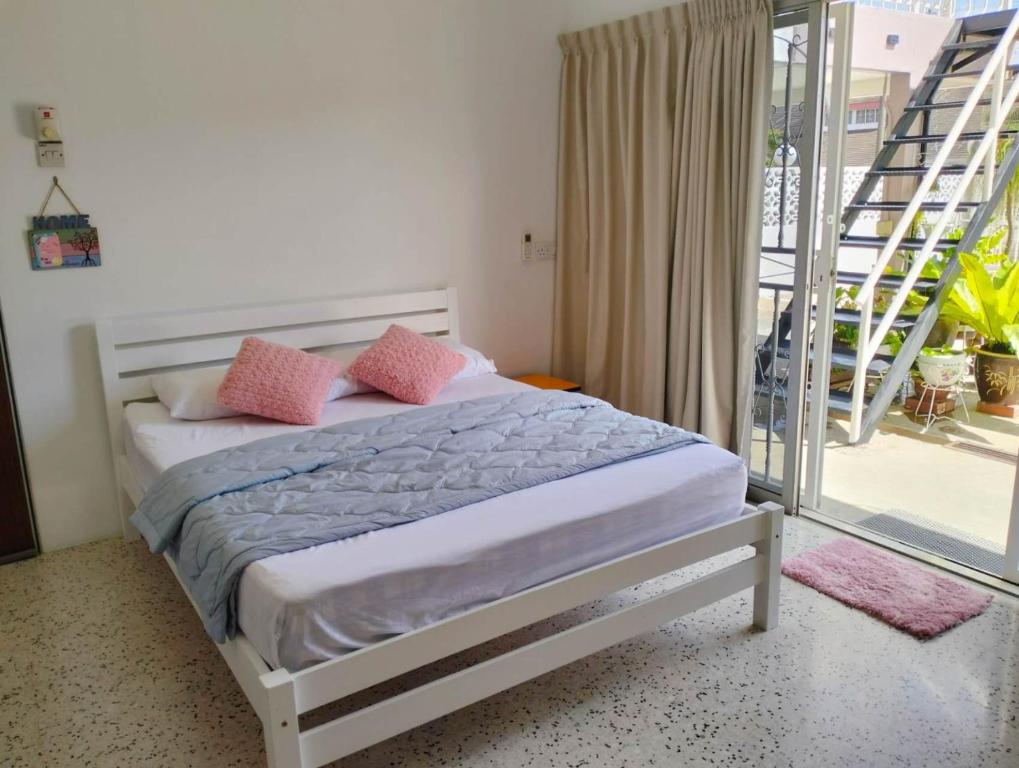Postel nebo postele na pokoji v ubytování 阳台民宿 16 Terrace