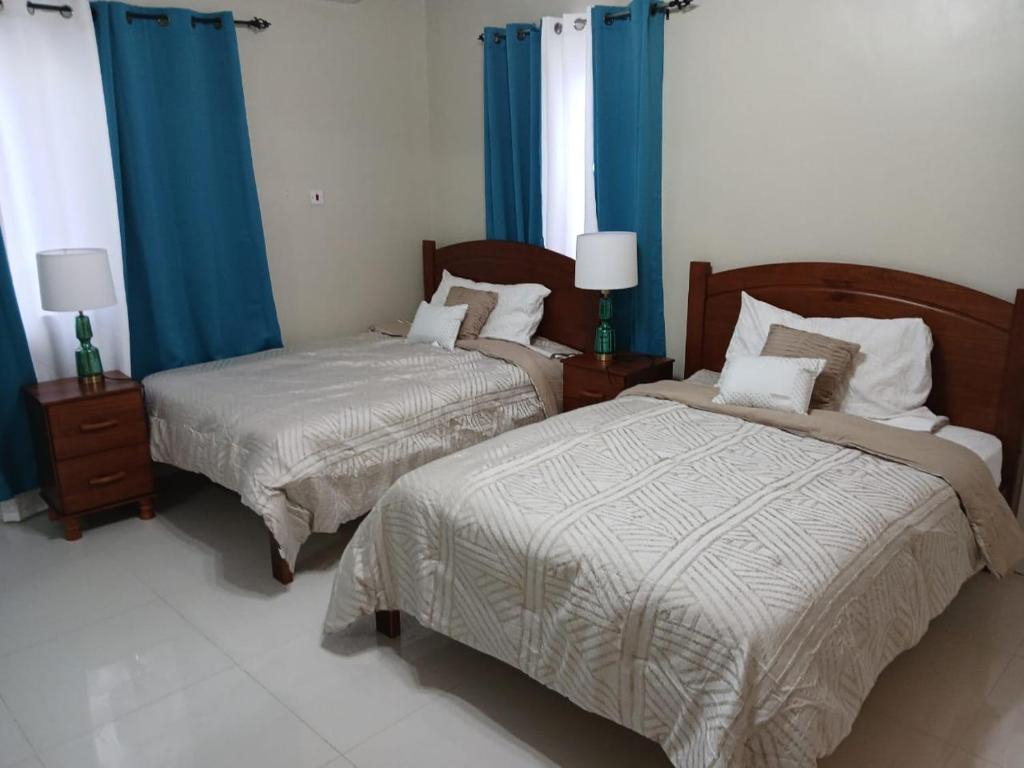 Katil atau katil-katil dalam bilik di Turquoise Villa