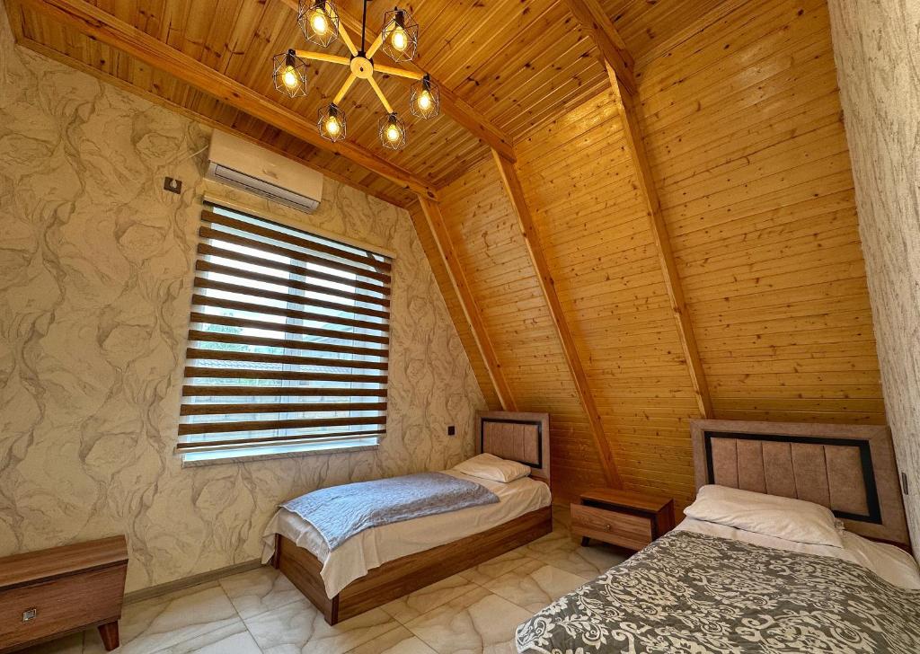 Postel nebo postele na pokoji v ubytování Gabala Chesnut Villa Resort