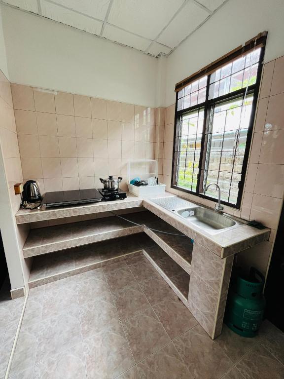 Kuchyň nebo kuchyňský kout v ubytování Baan Archa Samui