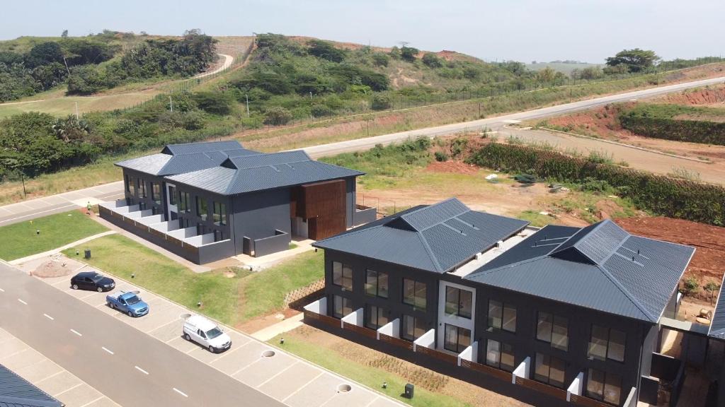 an overhead view of a house with a black roof at Ocean Club Zimbali Lakes Resort Ballito B13 in Durban