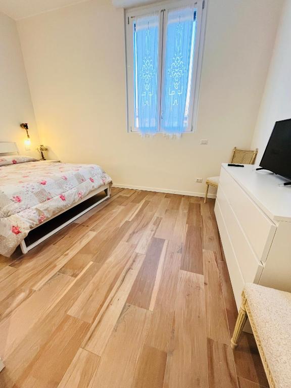 Postel nebo postele na pokoji v ubytování Corte Basiglio