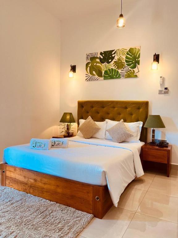 Postel nebo postele na pokoji v ubytování Blue Bird Hotels
